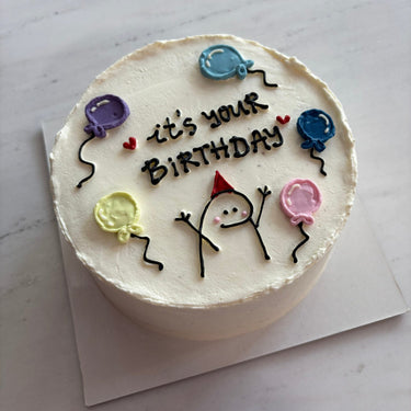 Round white cake with an illustration and the inscription 'it's your BIRTHDAY'