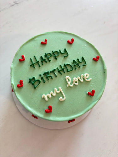 Кръгла ментова торта с брокат и надпис 'Happy Birthday my love' в блестящо покритие.