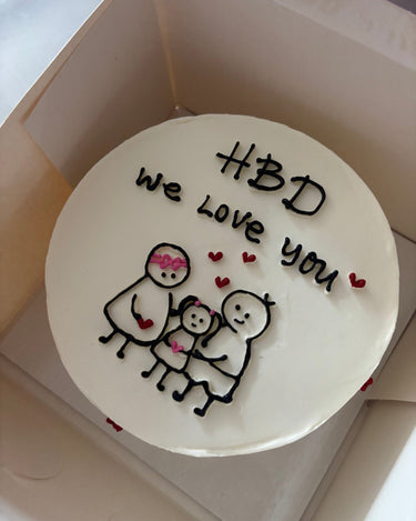 Кръгла бяла торта с рисунка и надпис 'HBD we love you'.