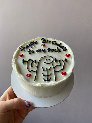 Кръгла бяла торта с рисунка и надпис 'Happy Birthday to my rock'
