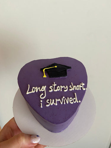 Сърцевидна лилава торта с рисунка и надпис 'Long story short. i survived.'