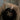 Черна торта сърце с кремав кант и златен надпис 'Leo Baby'