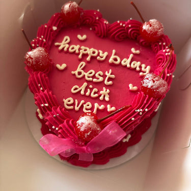 Розова торта сърце с черешки, кремав кант, панделки и перли, надпис happy bday best dick ever