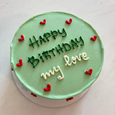 Кръгла ментова торта с брокат и надпис 'Happy Birthday my love' в блестящо покритие.